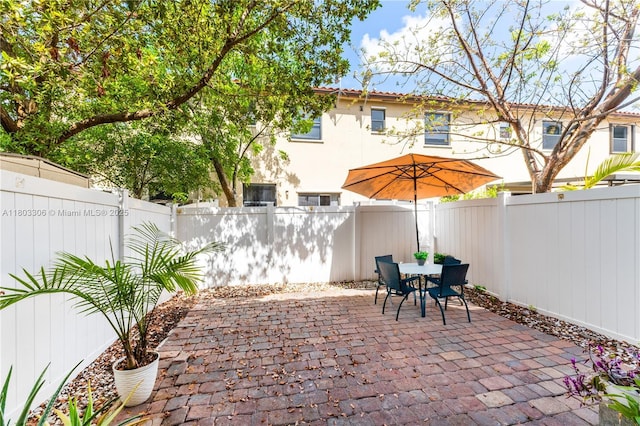 9214 W 33rd Ln, Hialeah, FL 33018 - fenced backyard with a patio area and outdoor dining area