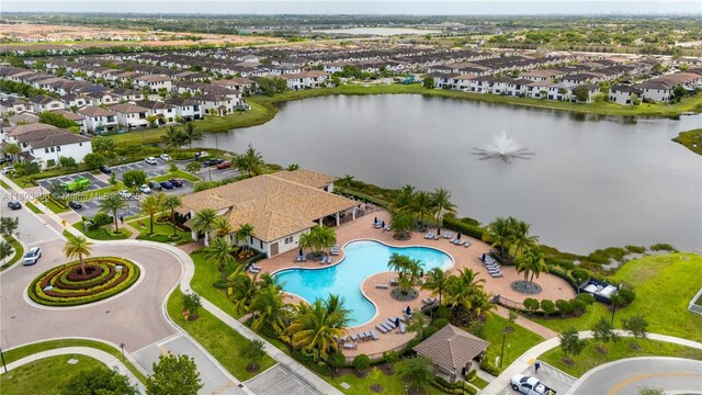 9214 W 33rd Ln, Hialeah, FL 33018 - aerial perspective of suburban area featuring a pool and a nearby body of water