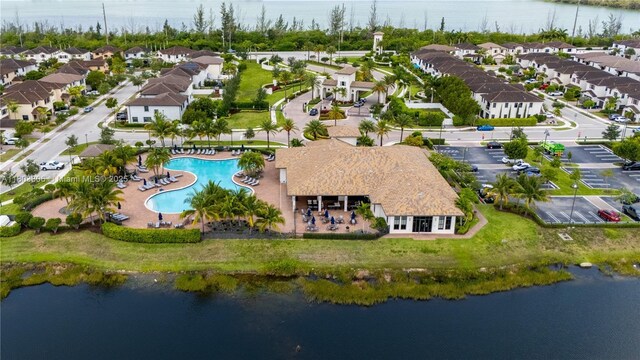 9214 W 33rd Ln, Hialeah, FL 33018 - aerial perspective of suburban area featuring a pool and a large body of water