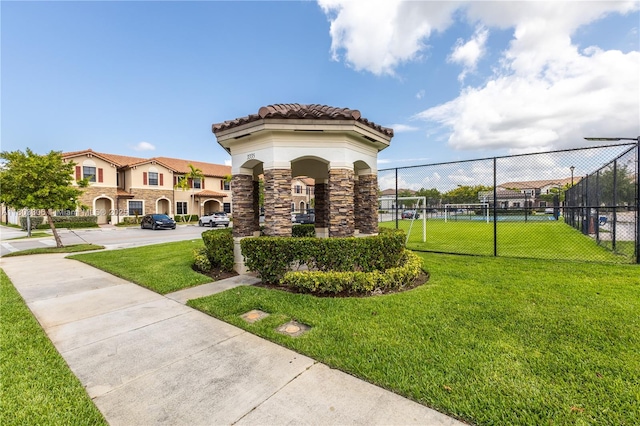9214 W 33rd Ln, Hialeah, FL 33018 - view of front of home featuring stone siding, stucco siding, a tile roof, and a residential view