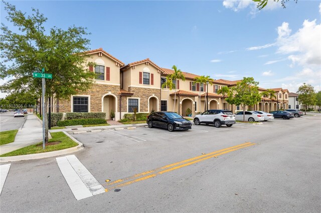 9214 W 33rd Ln, Hialeah, FL 33018 - view of building exterior with uncovered parking