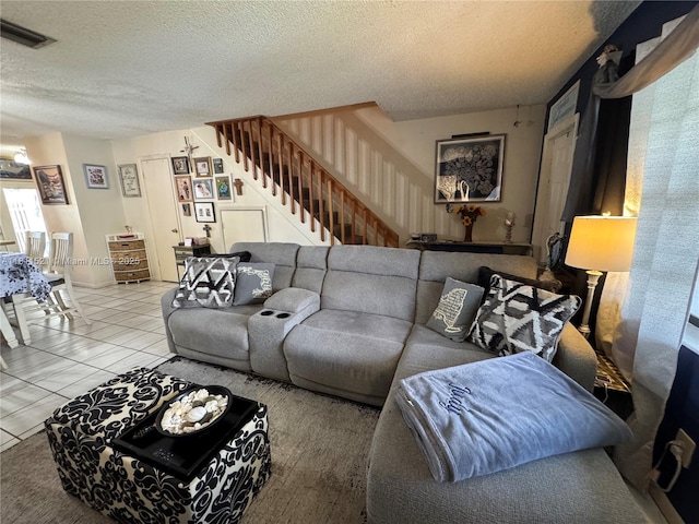 10428 NW 3rd St, Pembroke Pines, FL 33026 - living area featuring stairs, a textured ceiling, and tile patterned floors