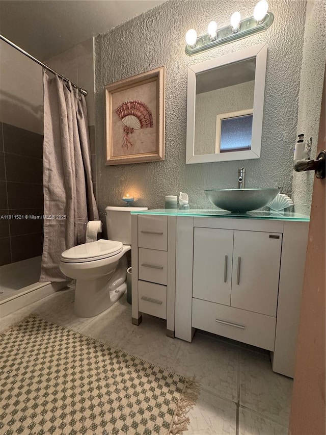 10428 NW 3rd St, Pembroke Pines, FL 33026 - bathroom with a textured wall, vanity, and a shower stall