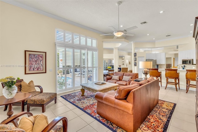 1220 Iris Ct, Weston, FL 33326 - living area with ornamental molding, ceiling fan, light tile patterned floors, and recessed lighting