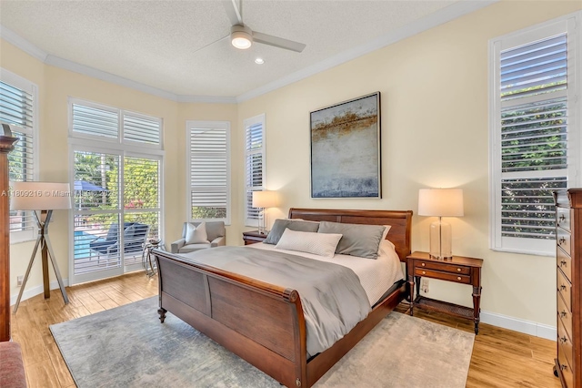 1220 Iris Ct, Weston, FL 33326 - bedroom with access to exterior, ornamental molding, baseboards, light wood finished floors, and recessed lighting