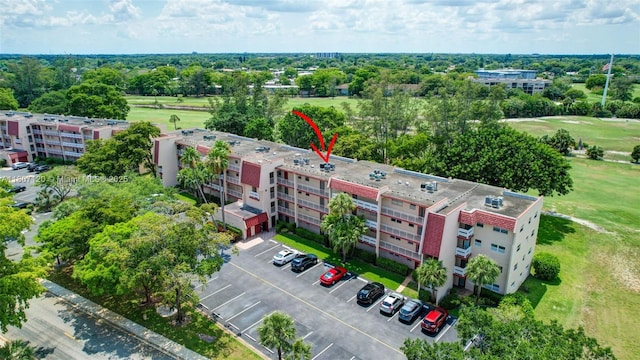 1055 Country Club Dr Unit 406, Margate, FL 33063 - drone / aerial view of apartment complex and a tree filled landscape