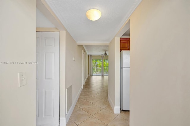 1055 Country Club Dr Unit 406, Margate, FL 33063 - corridor with light tile patterned floors, baseboards, a textured ceiling, and crown molding