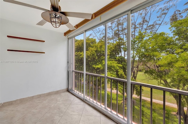 1055 Country Club Dr Unit 406, Margate, FL 33063 - unfurnished sunroom with tile patterned floors, healthy amount of natural light, baseboards, and view of wooded area