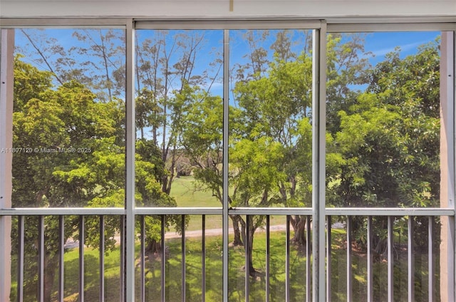 1055 Country Club Dr Unit 406, Margate, FL 33063 - unfurnished sunroom featuring view of scattered trees