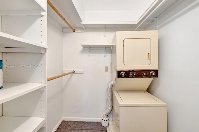 1055 Country Club Dr Unit 406, Margate, FL 33063 - laundry area with stacked washer / drying machine, carpet, and baseboards