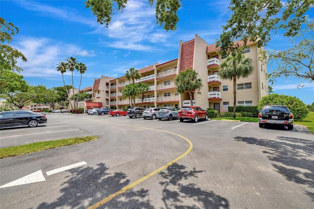 1055 Country Club Dr Unit 406, Margate, FL 33063 - view of apartment building / complex with uncovered parking