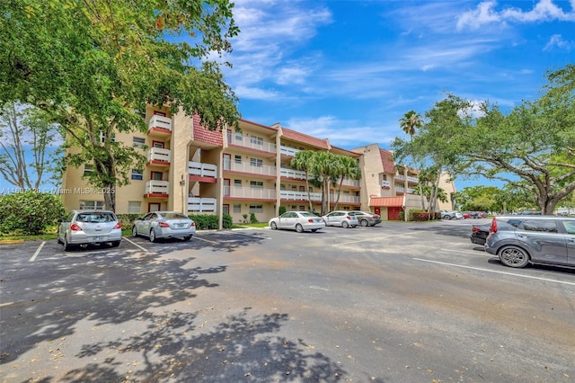 1055 Country Club Dr Unit 406, Margate, FL 33063 - view of apartment building / complex featuring uncovered parking