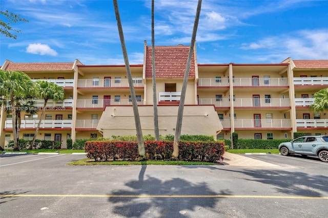 1055 Country Club Dr Unit 406, Margate, FL 33063 - view of apartment building / complex with uncovered parking