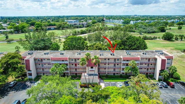 1055 Country Club Dr Unit 406, Margate, FL 33063 - aerial view of apartment complex / building, a golf course, and a tree filled landscape