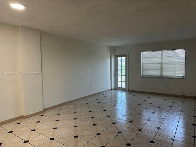 1130 11th St Unit 4J, Miami Beach, FL 33139 - unfurnished room with baseboards, a textured ceiling, and recessed lighting