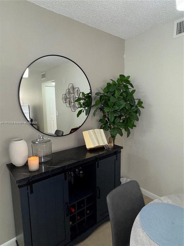 3586 N University Dr Unit U-6, Coral Springs, FL 33065 - detailed view of a textured ceiling, baseboards, and carpet floors