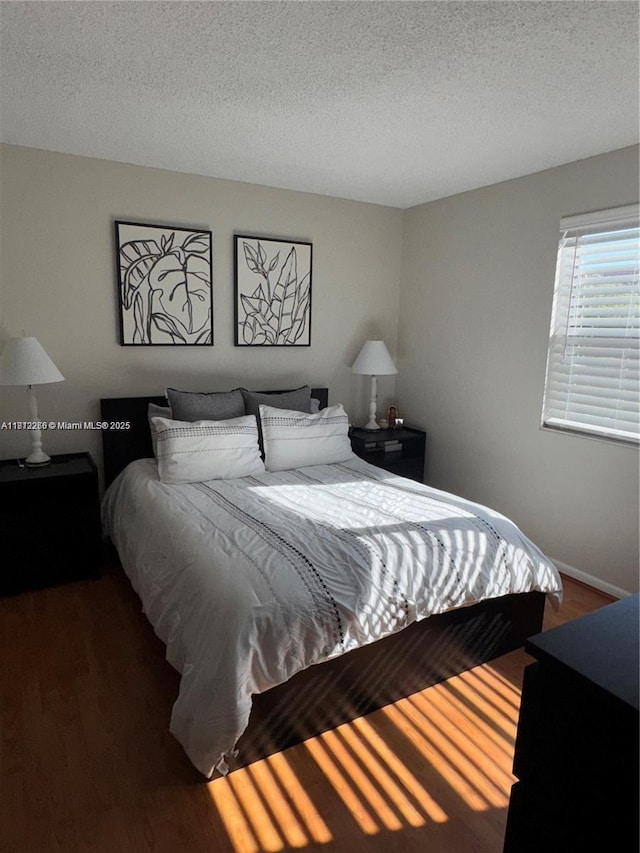 3586 N University Dr Unit U-6, Coral Springs, FL 33065 - bedroom featuring wood finished floors, a textured ceiling, and baseboards