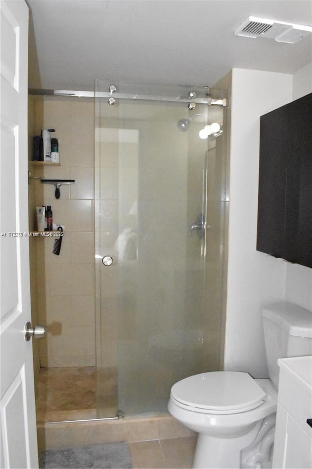 3586 N University Dr Unit U-6, Coral Springs, FL 33065 - bathroom featuring toilet, a stall shower, tile patterned flooring, and vanity