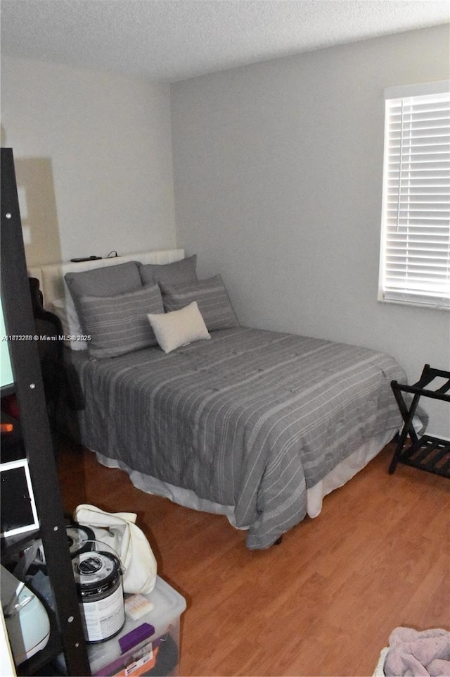3586 N University Dr Unit U-6, Coral Springs, FL 33065 - bedroom featuring wood finished floors and a textured ceiling