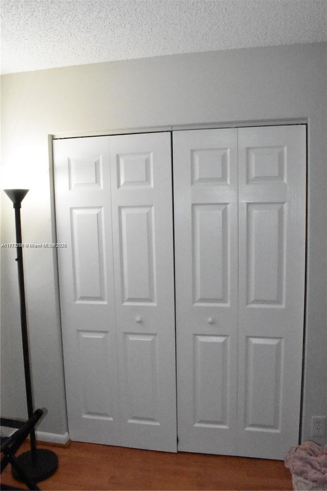 3586 N University Dr Unit U-6, Coral Springs, FL 33065 - detailed view of wood finished floors and a textured ceiling