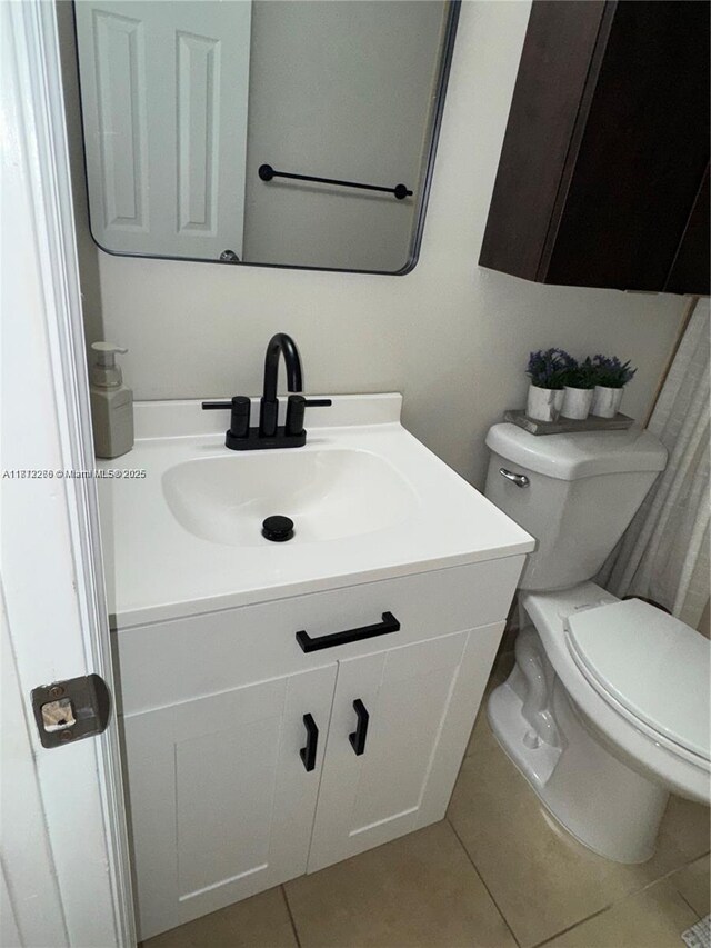 3586 N University Dr Unit U-6, Coral Springs, FL 33065 - bathroom featuring vanity, tile patterned flooring, and toilet