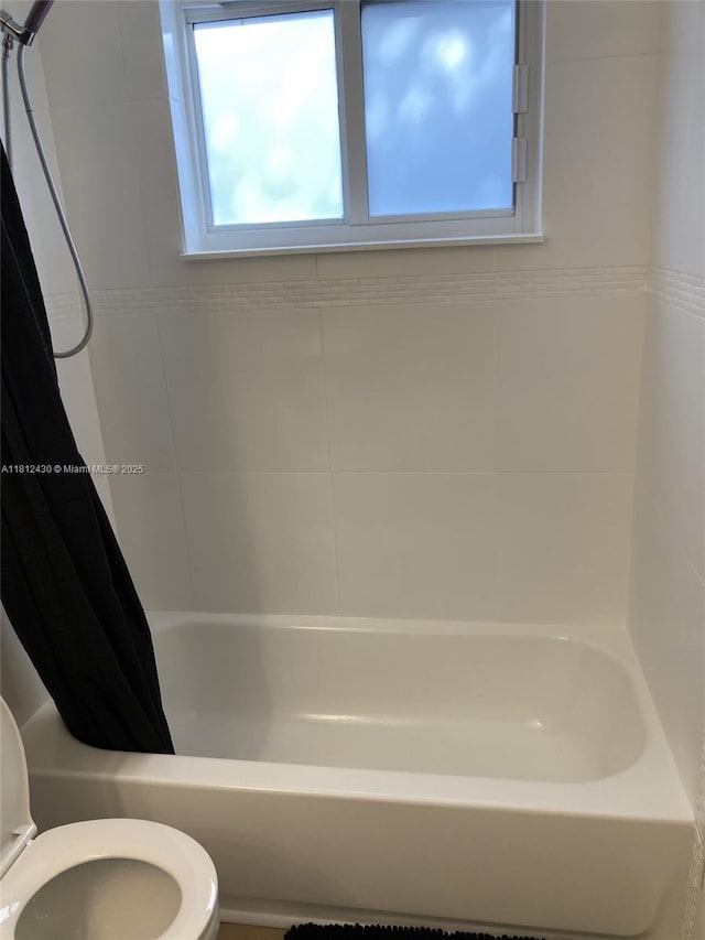 6132 SW 39th St, Miramar, FL 33023 - bathroom featuring toilet, plenty of natural light, and shower / bath combo with shower curtain