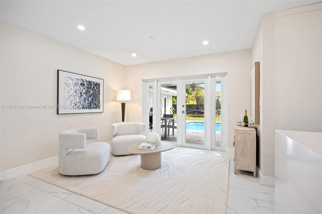 17243 SW 87th Ave, Palmetto Bay, FL 33157 - sitting room featuring french doors, light marble finish floors, recessed lighting, and baseboards