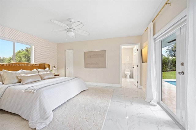 17243 SW 87th Ave, Palmetto Bay, FL 33157 - bedroom with access to outside, light marble finish floors, baseboards, a ceiling fan, and connected bathroom