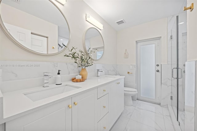 17243 SW 87th Ave, Palmetto Bay, FL 33157 - bathroom with marble look tiles, tile walls, a marble finish shower, double vanity, and toilet