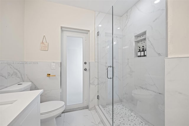 17243 SW 87th Ave, Palmetto Bay, FL 33157 - full bath with toilet, marble look tile flooring, a marble finish shower, vanity, and tile walls