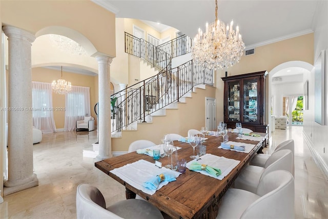 13255 Biscayne Bay Ter, North Miami, FL 33181 - dining room with a chandelier, arched walkways, crown molding, stairway, and decorative columns