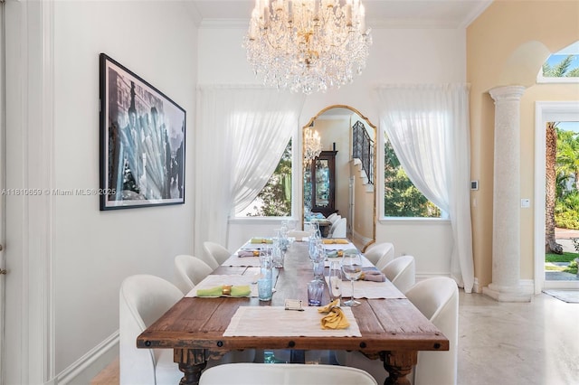 13255 Biscayne Bay Ter, North Miami, FL 33181 - dining area with a chandelier, ornate columns, arched walkways, healthy amount of natural light, and crown molding