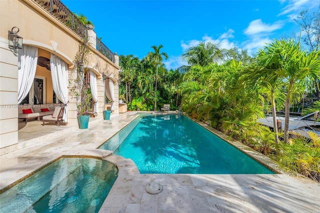 13255 Biscayne Bay Ter, North Miami, FL 33181 - view of swimming pool with a patio and a pool with connected hot tub
