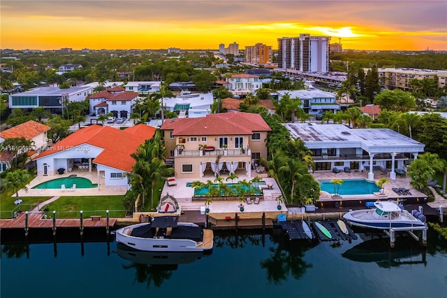 13255 Biscayne Bay Ter, North Miami, FL 33181 - view of subject property featuring a pool area and a large body of water