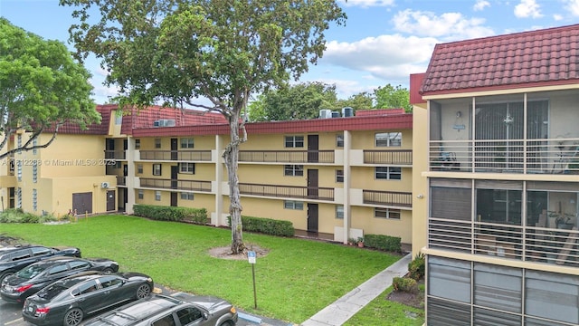 3253 Foxcroft Rd Unit G312, Miramar, FL 33025 - view of building exterior with uncovered parking