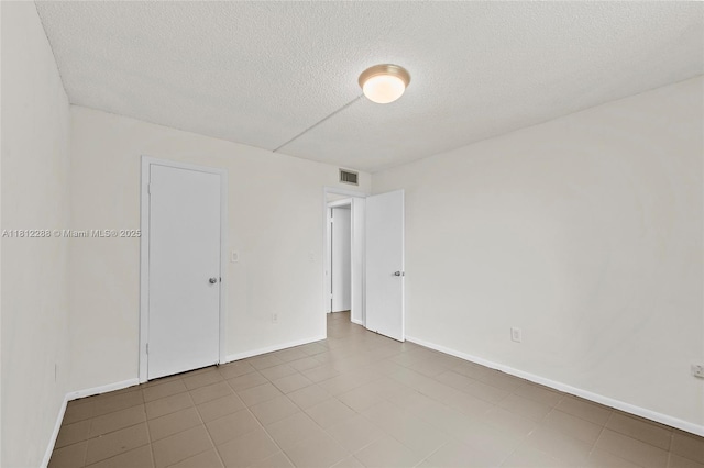 3253 Foxcroft Rd Unit G312, Miramar, FL 33025 - unfurnished room with a textured ceiling and baseboards