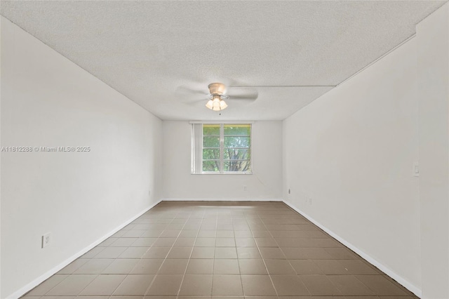 3253 Foxcroft Rd Unit G312, Miramar, FL 33025 - empty room with a ceiling fan, a textured ceiling, tile patterned flooring, and baseboards