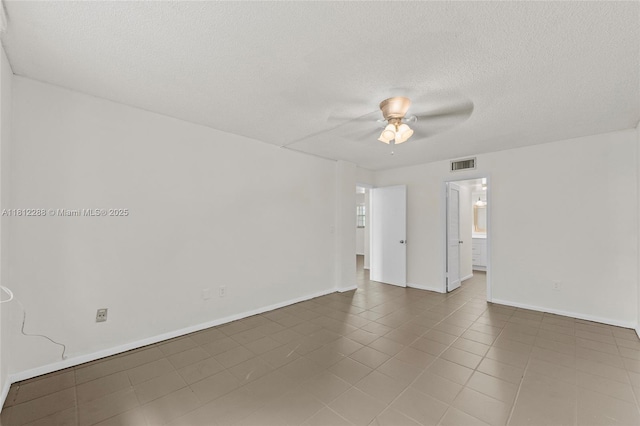 3253 Foxcroft Rd Unit G312, Miramar, FL 33025 - tiled empty room with a ceiling fan, a textured ceiling, and baseboards