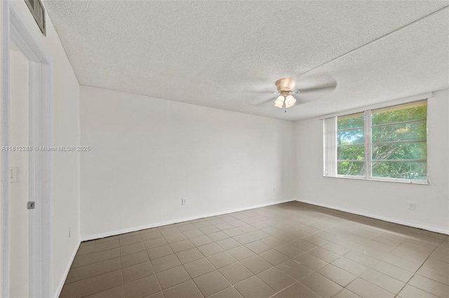 3253 Foxcroft Rd Unit G312, Miramar, FL 33025 - empty room with a textured ceiling, dark tile patterned flooring, baseboards, and ceiling fan