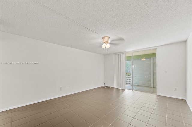 3253 Foxcroft Rd Unit G312, Miramar, FL 33025 - empty room featuring expansive windows, ceiling fan, tile patterned flooring, baseboards, and a textured ceiling