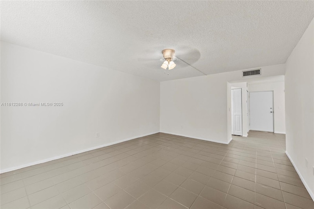 3253 Foxcroft Rd Unit G312, Miramar, FL 33025 - tiled spare room with a ceiling fan, baseboards, and a textured ceiling