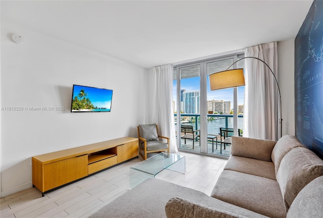 2602 E Hallandale Beach Blvd Unit R1009, Hallandale Beach, FL 33009 - living area featuring light wood-type flooring and baseboards