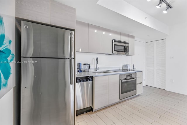 2602 E Hallandale Beach Blvd Unit R1009, Hallandale Beach, FL 33009 - kitchen with appliances with stainless steel finishes, a sink, modern cabinets, and light countertops
