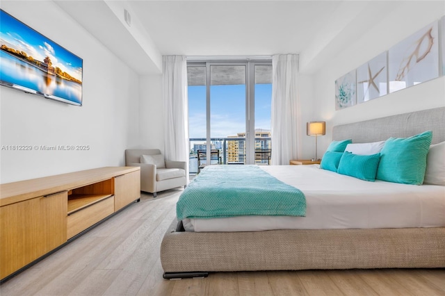2602 E Hallandale Beach Blvd Unit R1009, Hallandale Beach, FL 33009 - bedroom with light wood finished floors and access to exterior