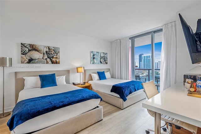 2602 E Hallandale Beach Blvd Unit R1009, Hallandale Beach, FL 33009 - bedroom with light wood-style floors and access to exterior