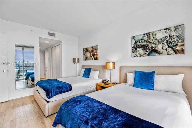 2602 E Hallandale Beach Blvd Unit R1009, Hallandale Beach, FL 33009 - bedroom featuring hardwood / wood-style flooring and access to exterior