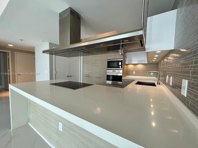 17301 Biscayne Blvd Unit 2105, North Miami Beach, FL 33160 - kitchen featuring black appliances, a sink, tasteful backsplash, a peninsula, and light countertops