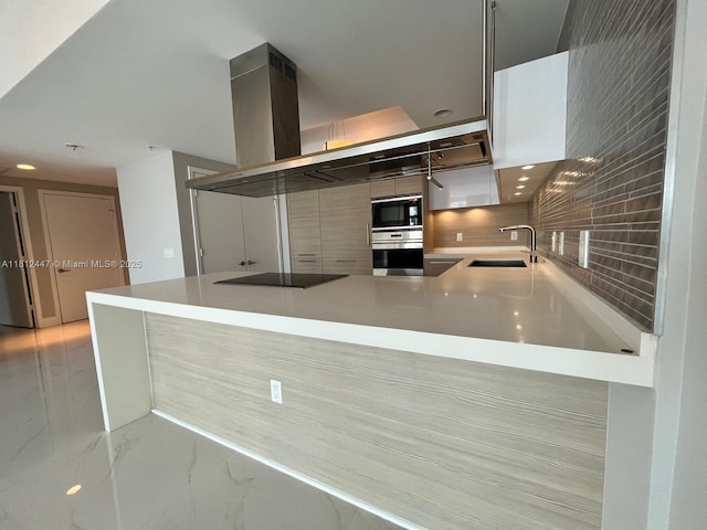 17301 Biscayne Blvd Unit 2105, North Miami Beach, FL 33160 - kitchen with black appliances, a sink, light marble finish floors, backsplash, and a peninsula
