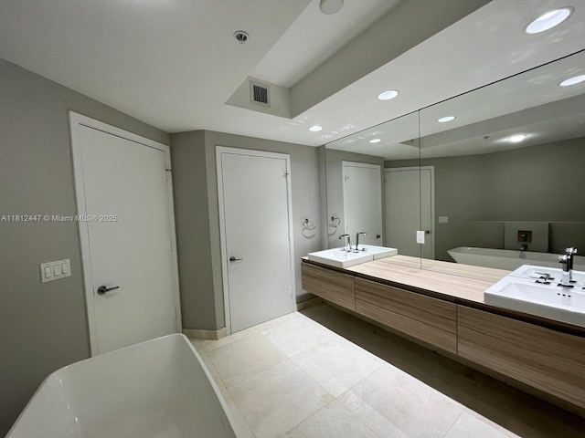 17301 Biscayne Blvd Unit 2105, North Miami Beach, FL 33160 - full bath with recessed lighting, double vanity, a freestanding tub, and tile patterned flooring