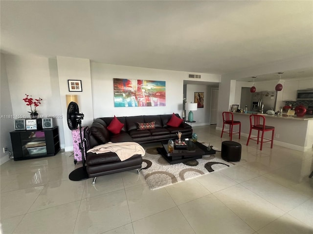 4330 Hillcrest Dr Unit 619, Hollywood, FL 33021 - living area with baseboards and light tile patterned floors